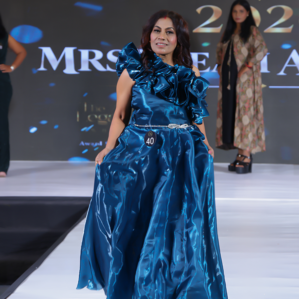 Bidesini Mali confidently walking the ramp in a blue ruffled gown during the Mrs Dream Aura India 2026 pageant.