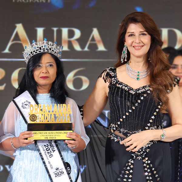 Saanvi Srivastava wearing her crown and sash while holding the Dream Aura India 2026 trophy as the West India Winner in the Miss category.