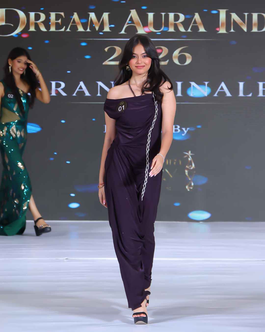 Mannat Chaudhary showcasing her ramp walk skills in a purple gown at the Miss Teen Dream Aura India 2026 pageant.