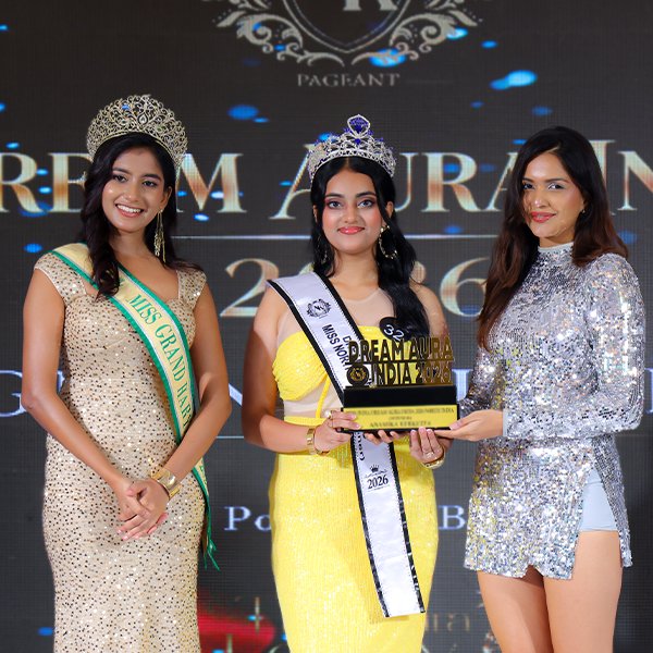 Saanvi Srivastava wearing her crown and sash while holding the Dream Aura India 2026 trophy as the West India Winner in the Miss category.